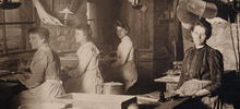 A black and white photo of an Abbott granule storage facility shows women at work.