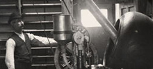 A black and white photo of an Abbott tablet production site and equipment in 1900.