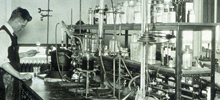 A black and white photo of Ernest Volwiler in the chemistry lab of Abbott in 1923.